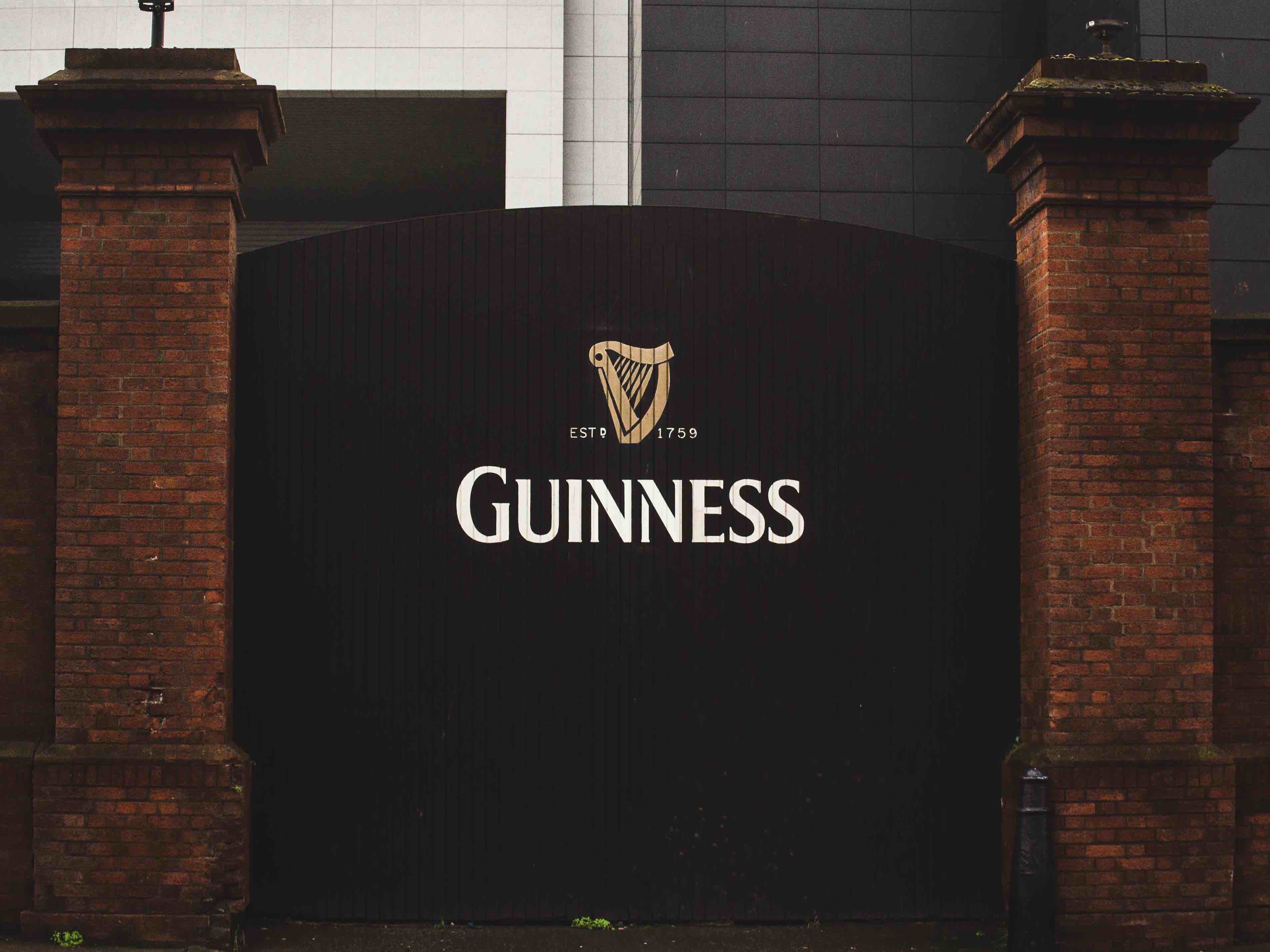 gate with the guinness logo on it
